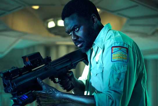 Babou Ceesay as Morrow holding a gun in Alien: Earth